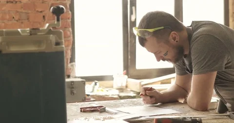 Carpenter draws, close-up, in carpentry workshop Stock Footage 74716031