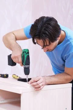 Carpenter with drill Stock Photos