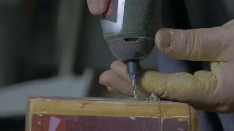 Carpenter drilling hole and howling screws with electric tools, hands close up. Stock Footage 57757765