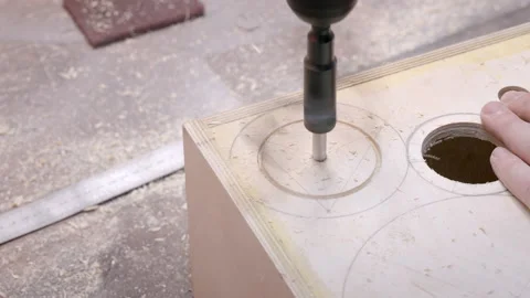 Carpenter drills hole on corner of crafted wooden box Video stock 195112760