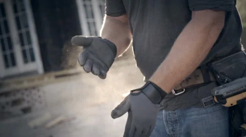 Carpenter dusting hands Stock Footage 38735135