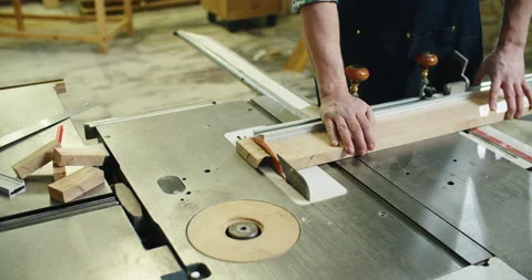 Carpenter engaged in his work. Wood cutting on the machine. Male hands close up Stock Footage 167284428