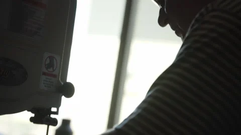 Carpenter expertly cutting wood using table saw in workshop setting Stock Footage 312712436