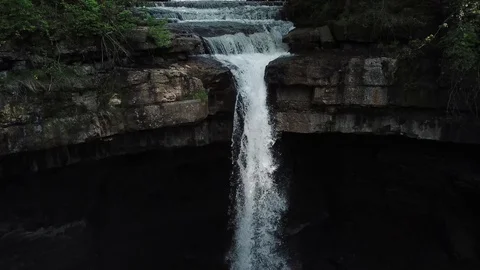 "Carpenter Falls" - Pan Backwards Over the Edge Stock Footage 109075423