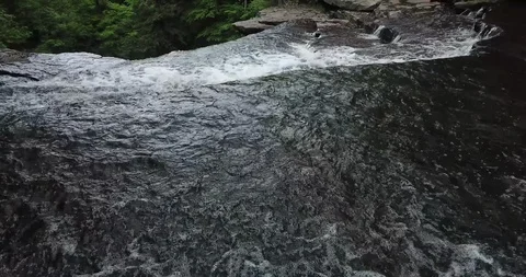 "Carpenter Falls" - Pan Forward Over the Cliff Edge Stock-Footage 109075371