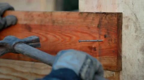 A carpenter fix a nail with his hammer Stock Footage 10788121
