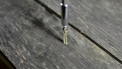 Carpenter fixing the aged weathered pine wood board Stock Footage 141066479