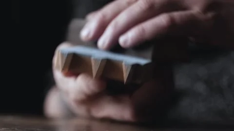 A carpenter grinds a painted wood part with a dovetail joint. homemade paint  Stock Footage 166557868