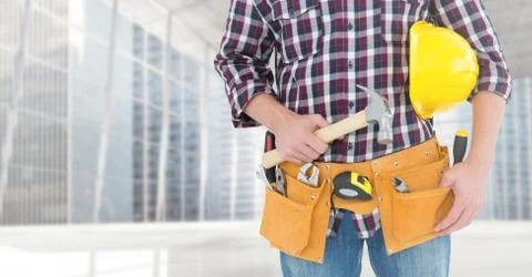 Carpenter with hammer against window Stock Photos