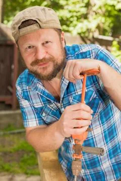 Carpenter with a hand drill Stock Photos