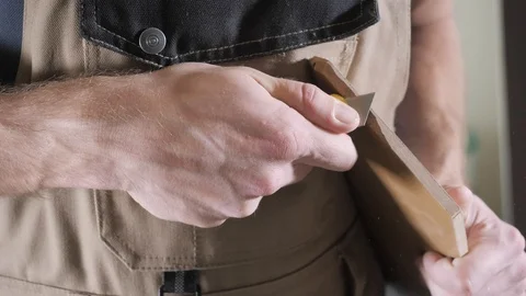 Carpenter hands cut laminate pieces with box cutter closeup Stock Footage 106376958