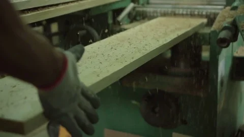Carpenter hands make plank. wood cutting machine slow motion Stock Footage 77671645