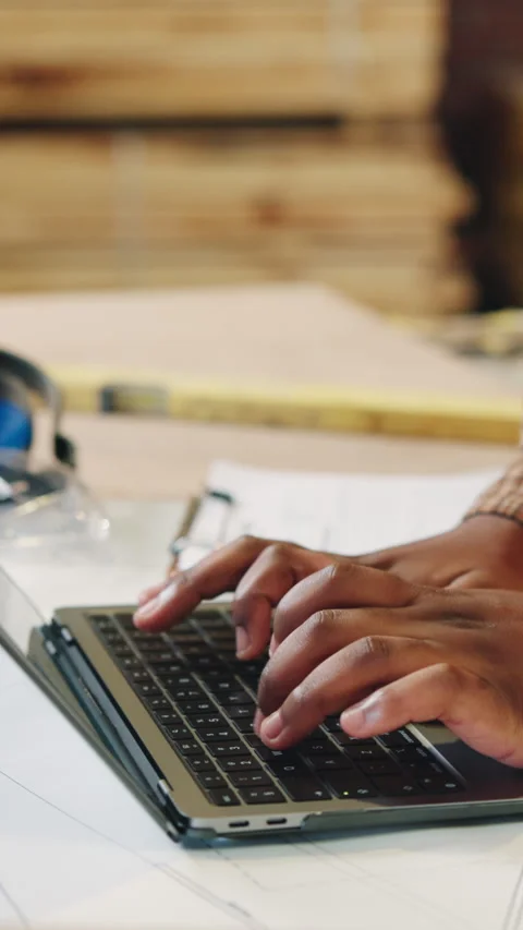 Carpenter, hands or typing with laptop in workshop for freight schedule, stock Stock Footage 343911541