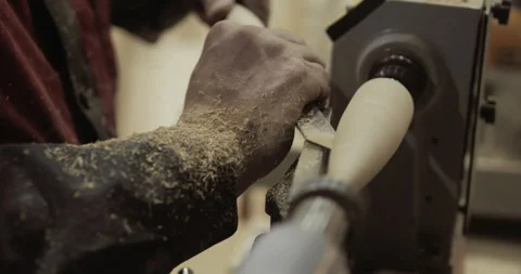 The carpenter with the help of a tool gives shape to wooden blanks on a machine Stock Footage 218597024
