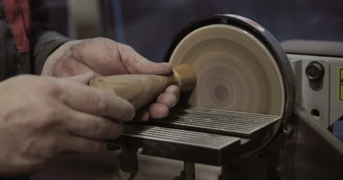 The carpenter with the help of a tool gives shape to wooden blanks on a machine. Stock Footage 218601143