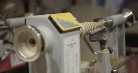 The carpenter with the help of a tool gives shape to wooden blanks on a machine. Stock Footage 218601172