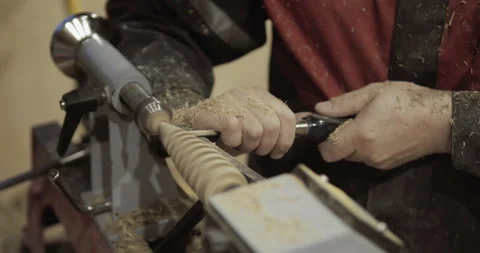The carpenter with the help of a tool gives shape to wooden blanks on a machine. Stock Footage 218601225
