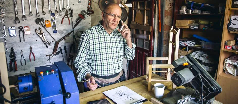 Carpenter in his workshop Stock Photos