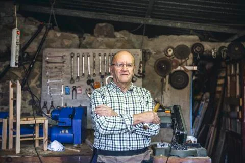 Carpenter in his workshop Stock Photos