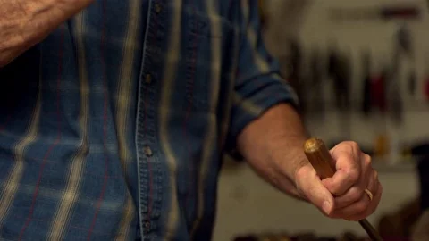 Carpenter hitting the chisel with hammer in slow motion Video stock 81231341