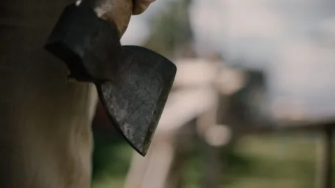 Carpenter hold carving axe by side before pulling up to start working Stock Footage 271187214
