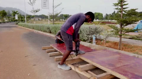 A Carpenter of Indian Origin is seen with a Drilling machine in  India. Video stock 156085728