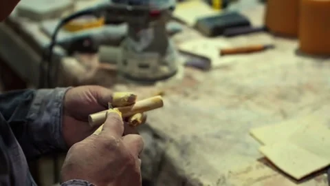 Carpenter joiner assembling furniture in which the parts Stock Footage 284827077