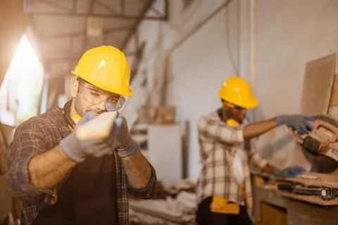 Carpenter joiner worker men work in furniture factory, professional wood wo.. Stock Photos