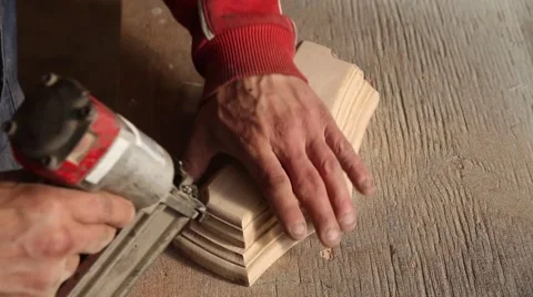Carpenter joins woodwork nails Stock Footage 58496113