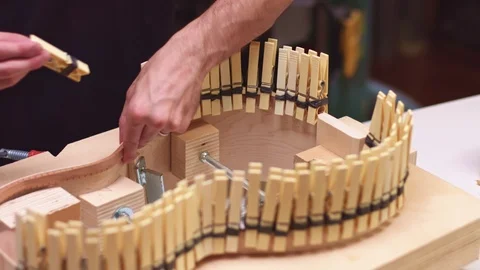 Carpenter lining acoustic guitar Stockbeeldmateriaal 117970108