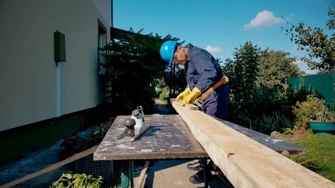 Carpenter makes marks on board Stock Footage 99019553