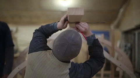 Carpenter makes measurements and mark with a pencil Stock Footage 59560531