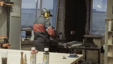 The carpenter makes the processing of wood blanks in the workshop. Stock Footage 218595065