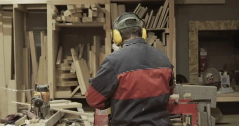 The carpenter makes the processing of wood blanks in the workshop. Stock Footage 218596609