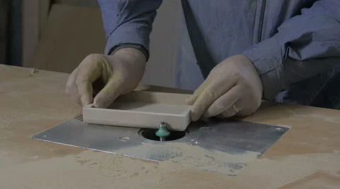 Carpenter making edges on box with electric grinder in workshop,close up,tilt up Stock Footage 57749398