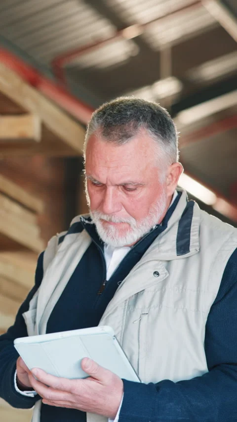 Carpenter, man and browsing in workshop with tablet, manufacturing and check Stock Footage 343816390