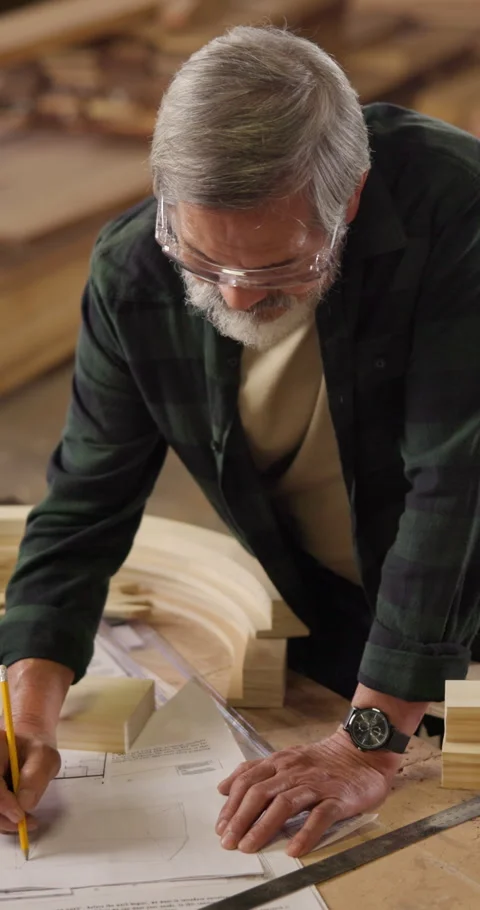 Carpenter, man and drawing blueprint for manufacturing, development guide or Stock Footage 340958188