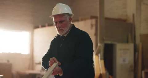 Carpenter, man and inspection in workshop with timber, level tools or review for Stock Footage 341382561