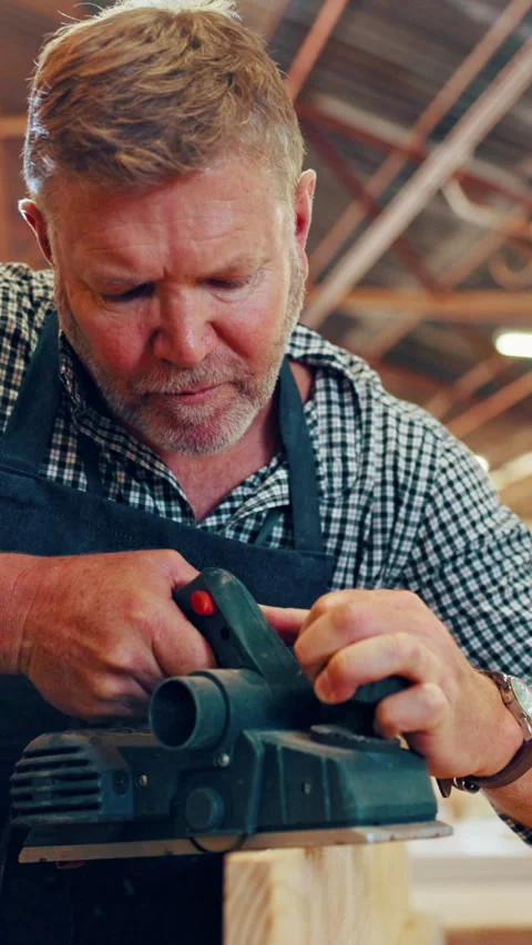 Carpenter, man and sanding in workshop with wood, power tool and precision for Stock Footage 340382731