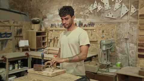 Carpenter man portrait at workshop. Tools background. Happy smiling joiner work. Stock Footage 272760120