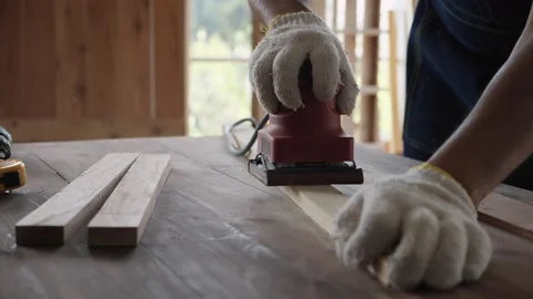 Carpenter man working with electrical sander on surface wood. Video stock 149040174