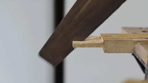 Carpenter man working hand saw on wood craft to produce construction material or Stock Footage 152347930