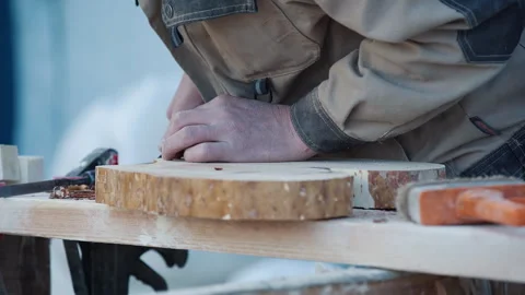 Carpenter Manually Processing Piece Of Wood With Woodworking Instruments Stock Footage 243816679