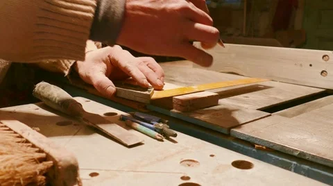 Carpenter Marking Wood With Square And Pencil Vidéo 58678575