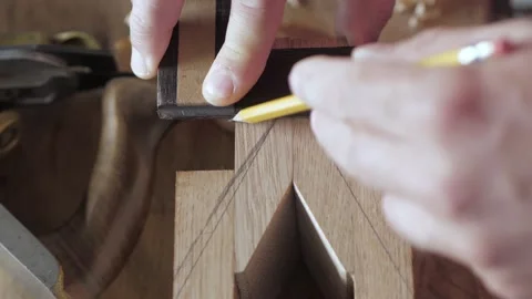 A carpenter marks a wooden board with a try Square. Square frame Stock Footage 156690698