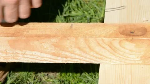 Carpenter measure wooden plank Stock Footage