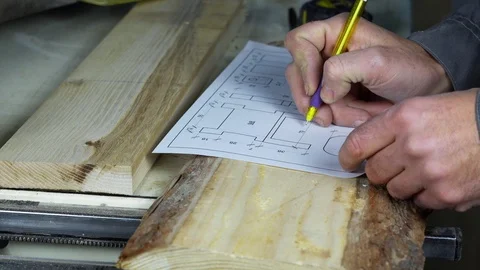 Carpenter measures the item Stock Footage 101944238