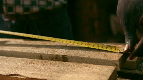Carpenter measuring in africa Stock Footage 170870688