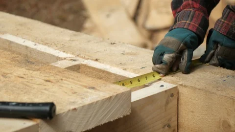 Carpenter measuring with cell phone taking photo close up in 4k 動画素材 126727426