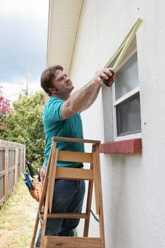 Carpenter Measuring Windows Stock Photos